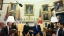President Macron and President Trump with interpreters and other officials