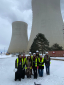 A group of students posing next to the Temelin Nuclear Power Reactor