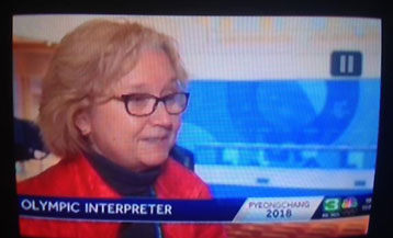 Andrea Hofmann-Miller being interviewed on TV