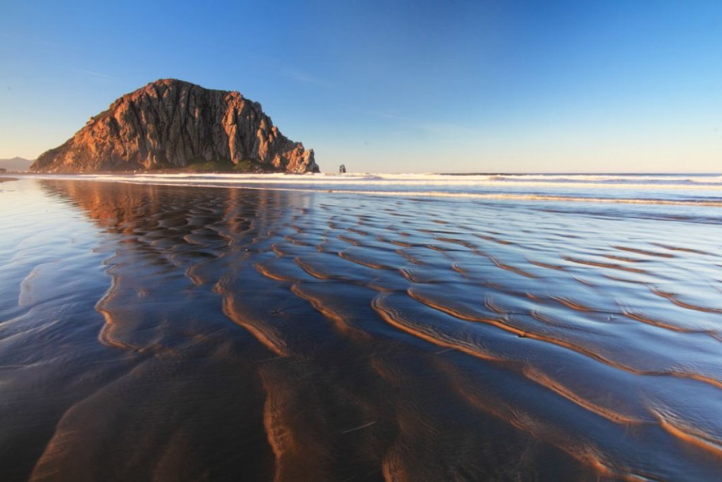 Morro Rock, a tall formation on an expansive beach, Morro Bay, California