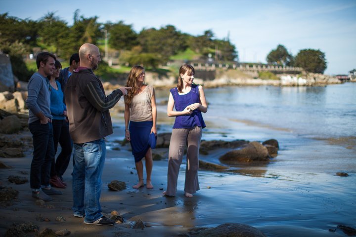 Professor Jason Scorse and students at the beach