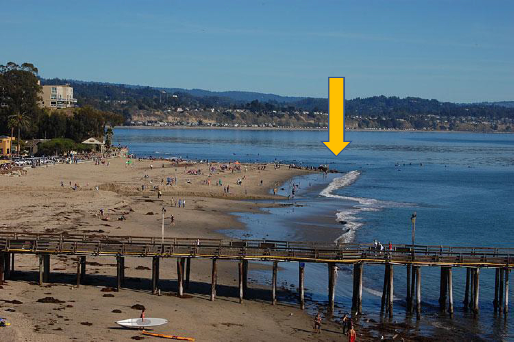 Capitola Beach with a yellow arrow to show a beach groin