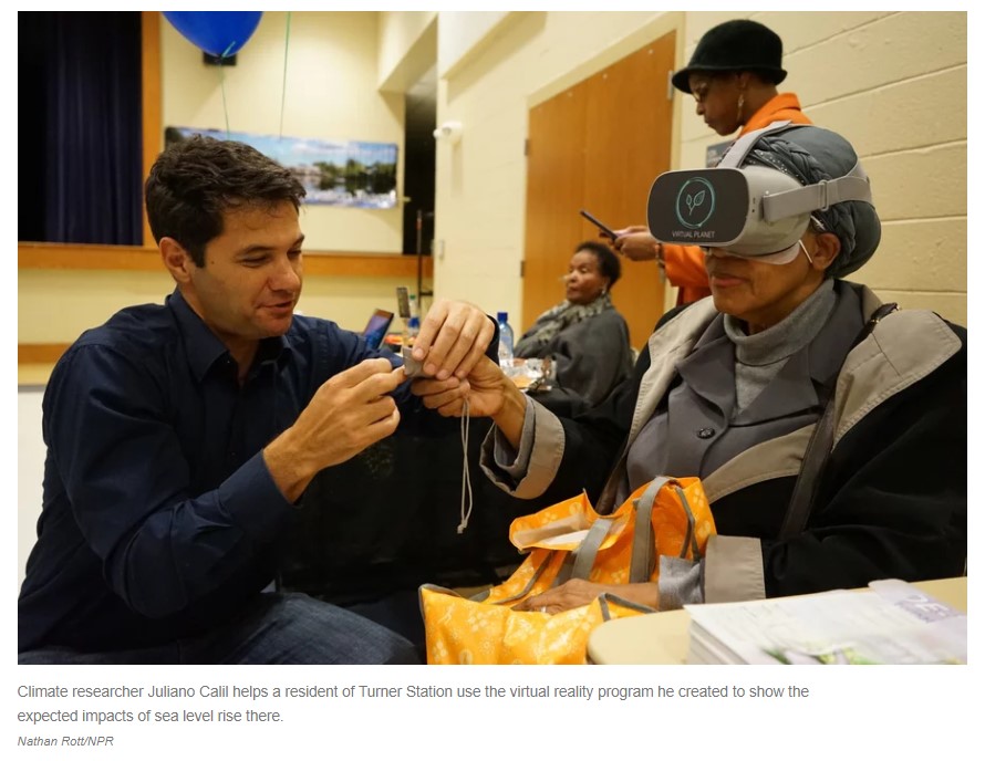 Dr. Juliano Calil sets up a community participant with the VR goggles