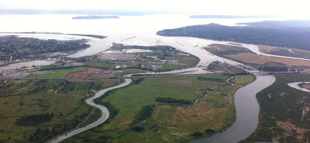 Snohomish Estuary, Washington State, and aerial view showing a good mix of development and the natural curing waterways of the estuary, leading out to the Puget Sound