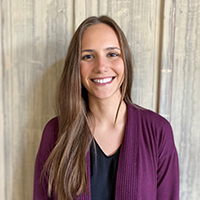 Emily Zimmerman looking smart and good-natured for her professional headshot