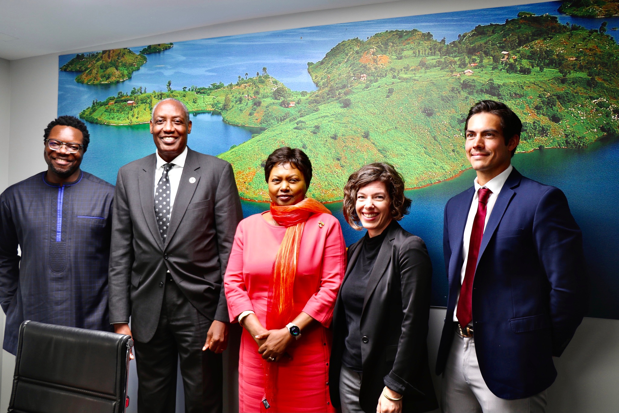 Image of MIIS student, Harrison Livesay at the Rwandan Embassy in DC with team members and AWFs CEO, Kaddu Sebunya, and the Rwandan ambassador Mathilde Mukantabana