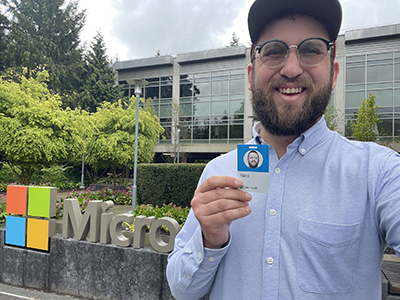 A very happy alum Nico de Golia showing off his Microsoft badge