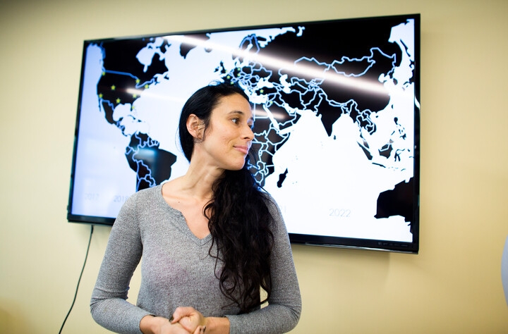 Celina Souffrant standing in front of a map