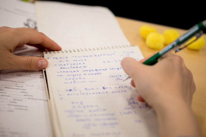 Notebook and hand writing in Russian