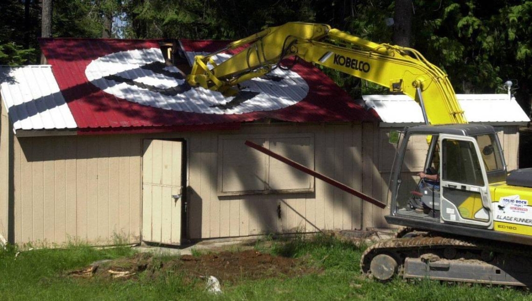 Image of Aryan Nations compound being demolished.