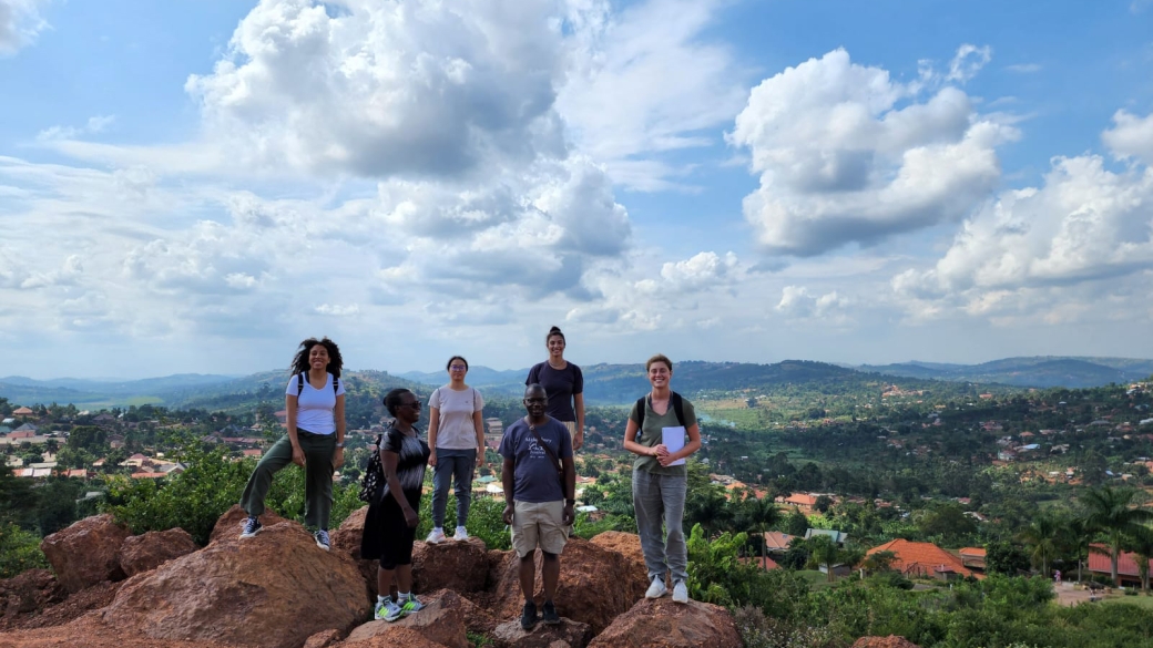 Students standing on top of a mountain.