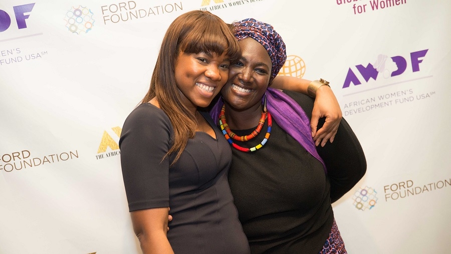 MIIS alumna, Maame Afon, hugging a colleague at the Africa Women's Development Forum