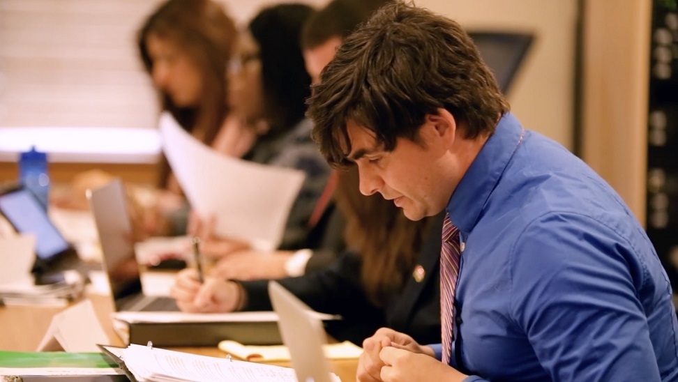 Nonproliferation and Terrorism Studies student in classroom studying documents