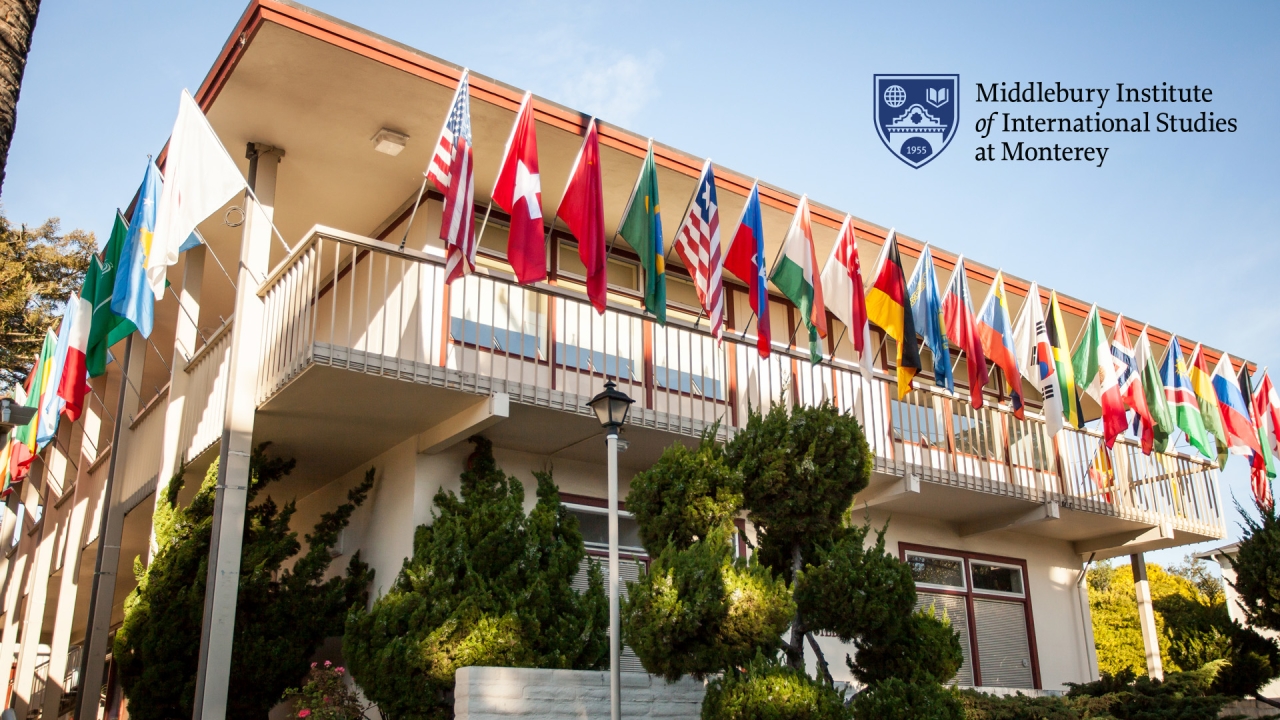International flags fly on a building on the Monterey campus.