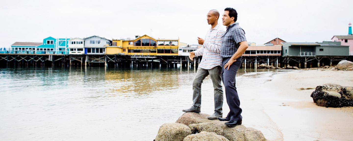 Two students stand on one of the beaches of Monterey Bay.