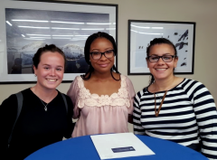 Three female SILP 2019 students smiling at the camera
