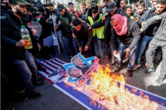 Palestinian demonstrators burn portraits of U.S. President Donald Trump and Israeli Prime Minister Benjamin Netanyahu with the slogan in Arabic "Down with the Deal of the Century" during a protest in Gaza's Jabalia refugee camp on Jan. 31 FP via MOHAMMED ABED/AFP via Getty Images