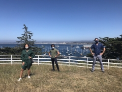 Three students outside in Monterey with masks