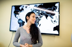 Celina Souffrant standing in front of a map