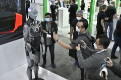 People taking photos of the Ameca humanoid robot