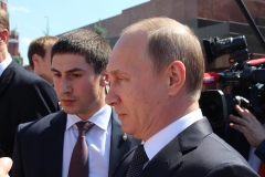 Putin outside interacting with reporters
