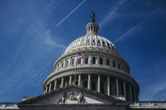 Photo of the dome of the U.S. Capitol in Washington, D.C., with blue sky behind.