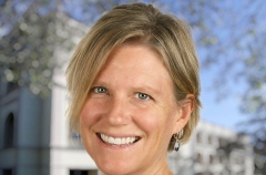 Laura Engeman smiling, short hair, looking smart and energetic