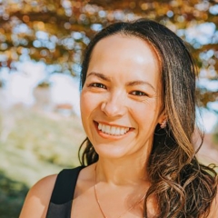 Silvia Sanchez Bor, headshot with a rich smile, direct gaze, looking smart and capable
