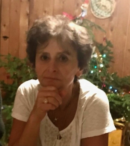 Professor Cohen looks into the camera in a white shirt and short brown hair.