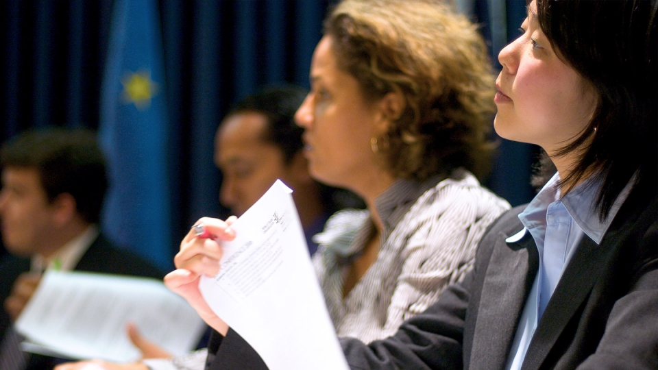 Students participating in simulated international negotiations.