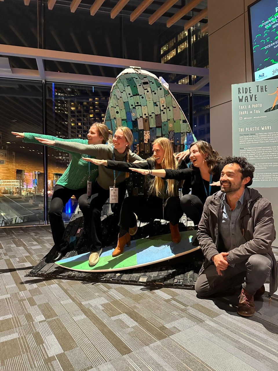 Environmental Policy students Hannah Ditty, Libby Mohn, Liz Hoffius, Molly Ryan, and Diego Tabilo at the IMPAC5 conference in Vancouver, Canada posing as if surfing