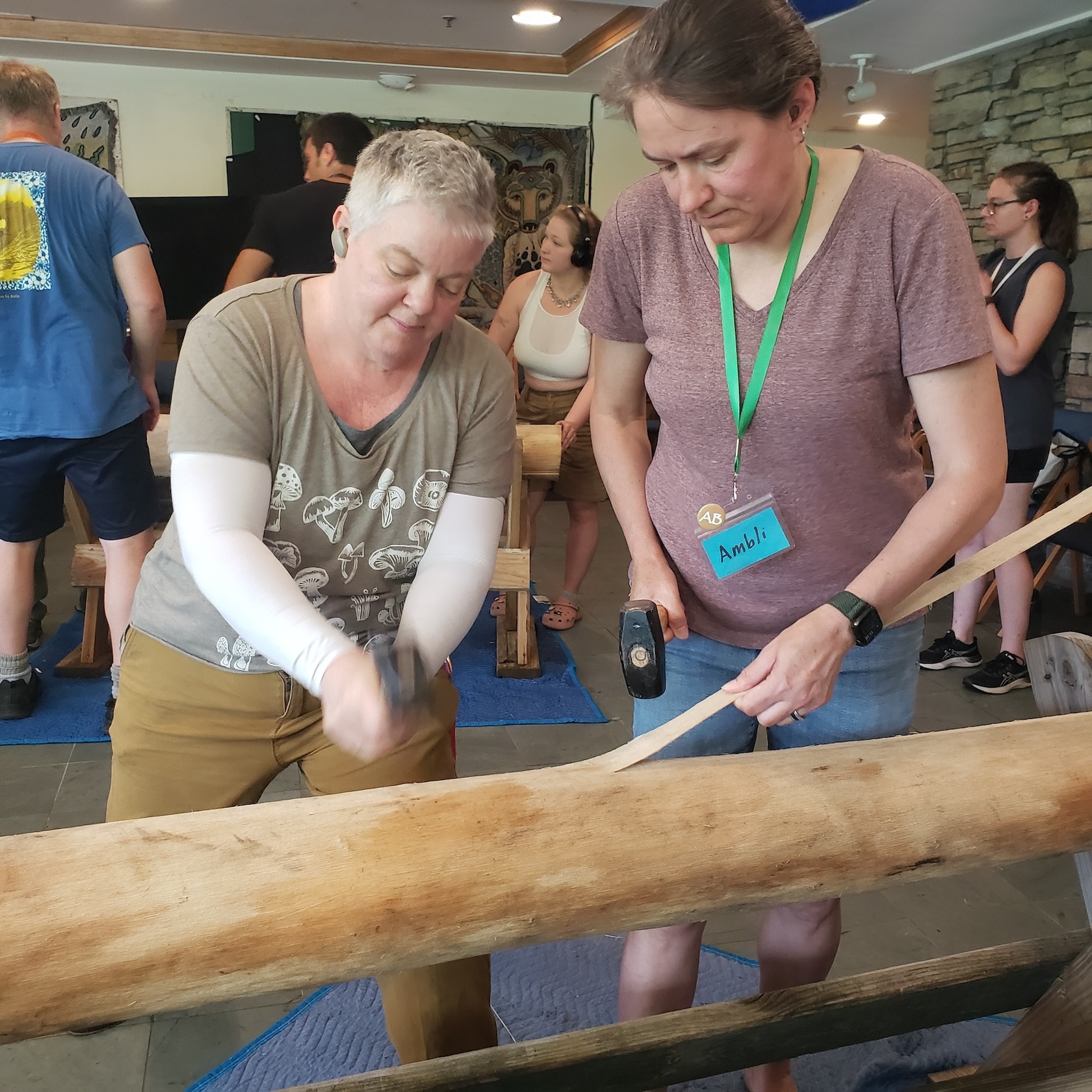 Students work with wood together. 