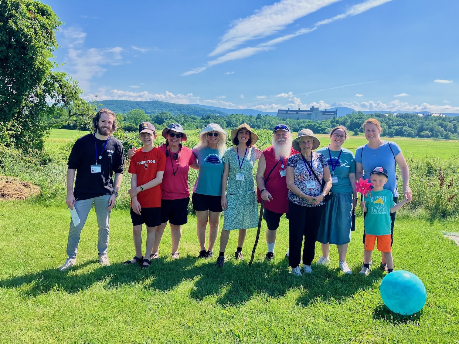 A group of friends from the School of Hebrew smiling in the sun. 