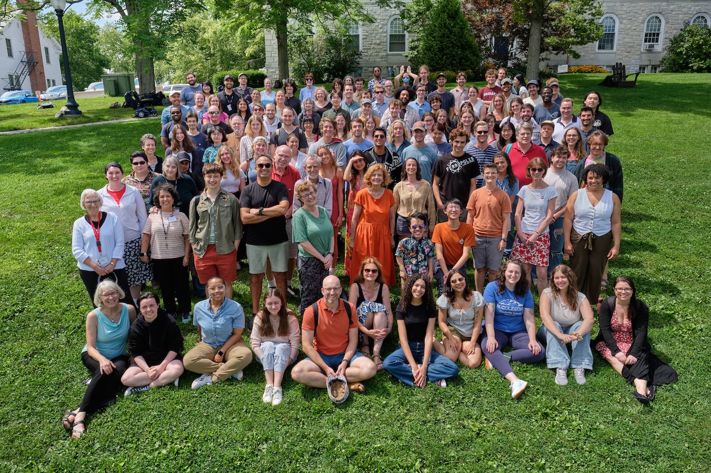 A group of students smiles on the lawn at Middlebury, College
