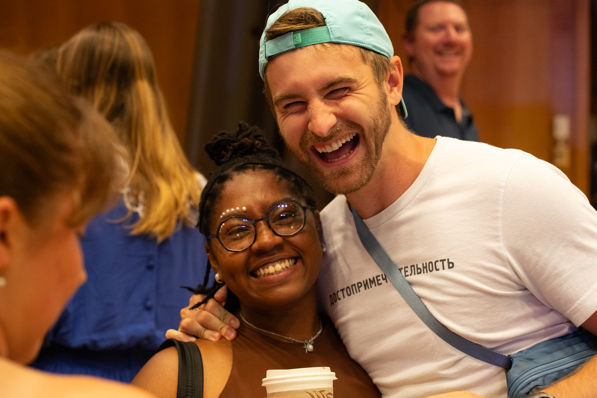 Students smile at the camera. 