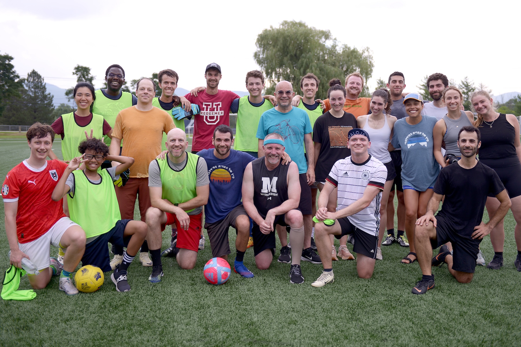 The School of Hebrew soccer team smiles at the camera. 