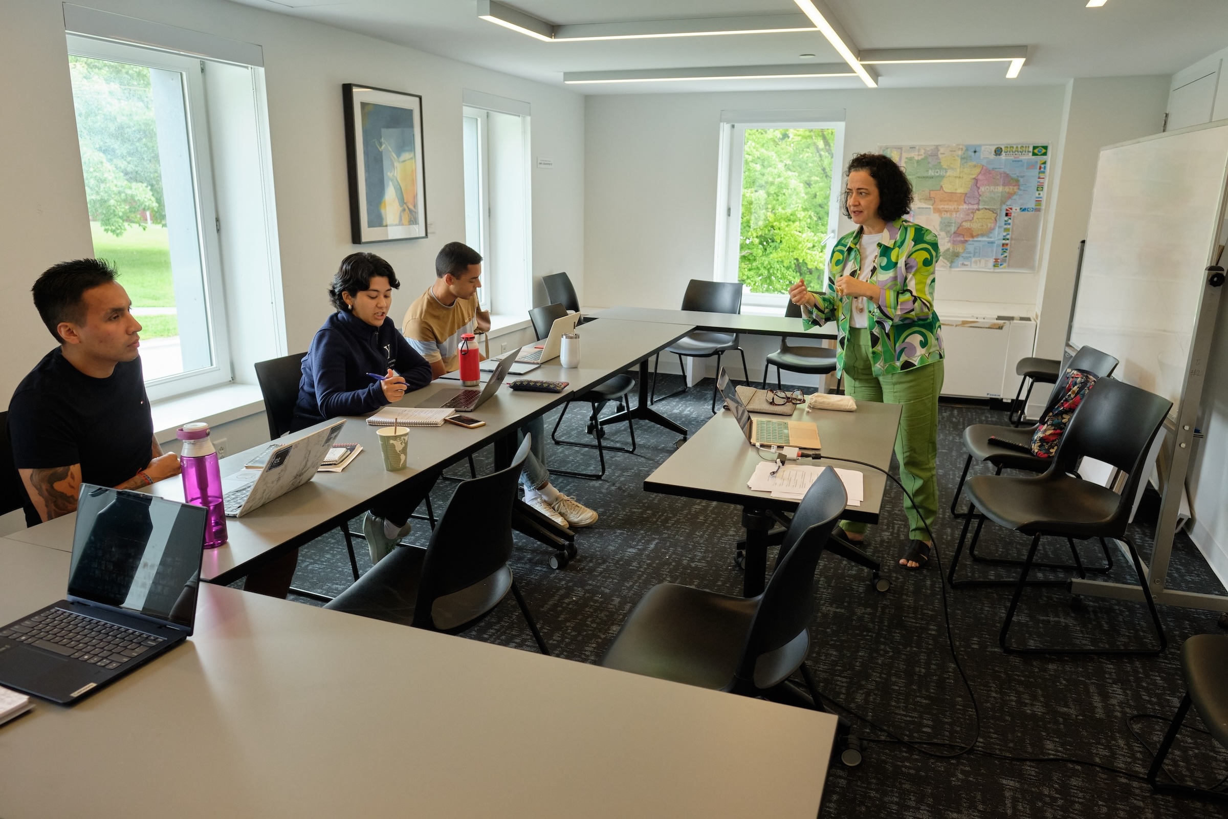 Students look up at their teacher in Portuguese class. 