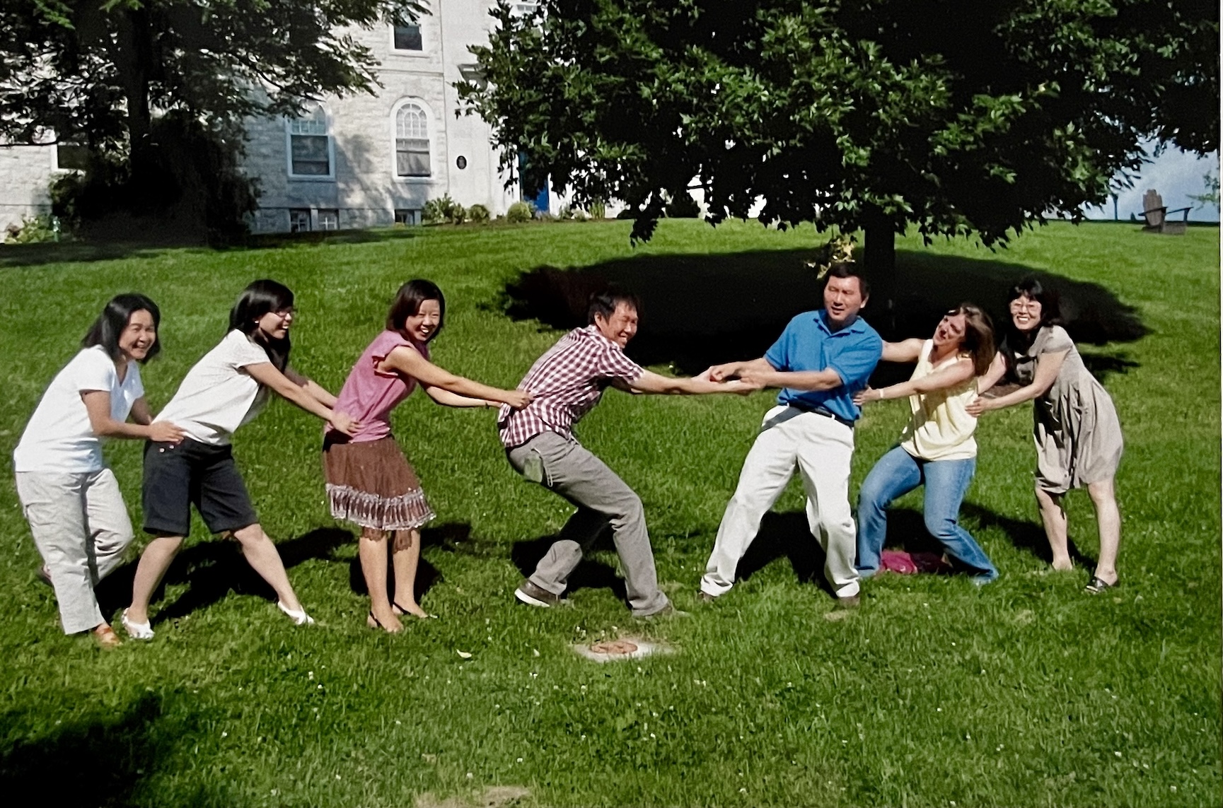 Faculty at the Chinese School play tug of war.