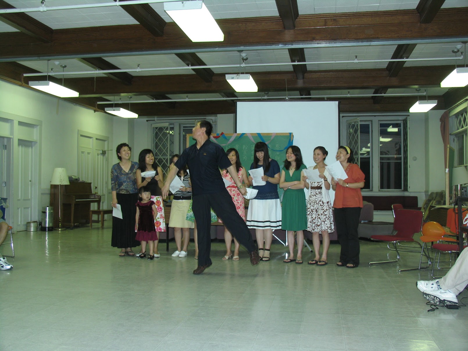 A man strikes a pose at the Chinese School at Middlebury College.
