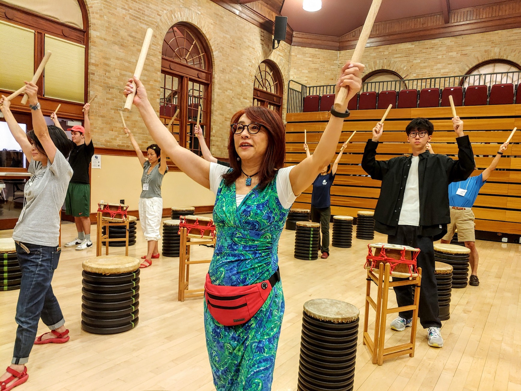 Students take a drumming class at the School of Japanese with director Motoko Tabuse. 