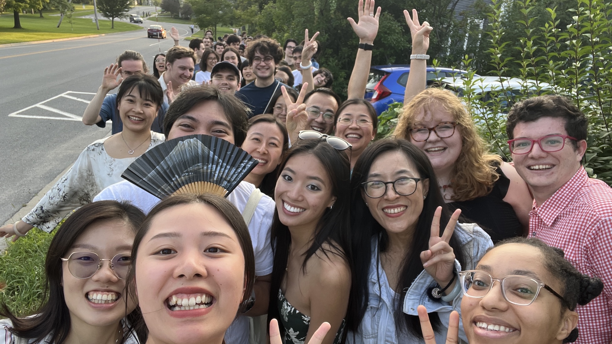 A group of students at the Chinese School smiles at the camera. 