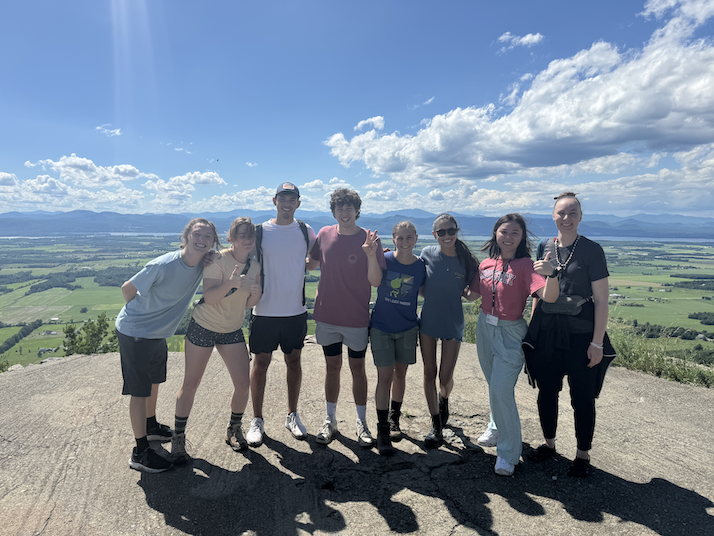 Chinese School students smile on top of Snake Mountain. 