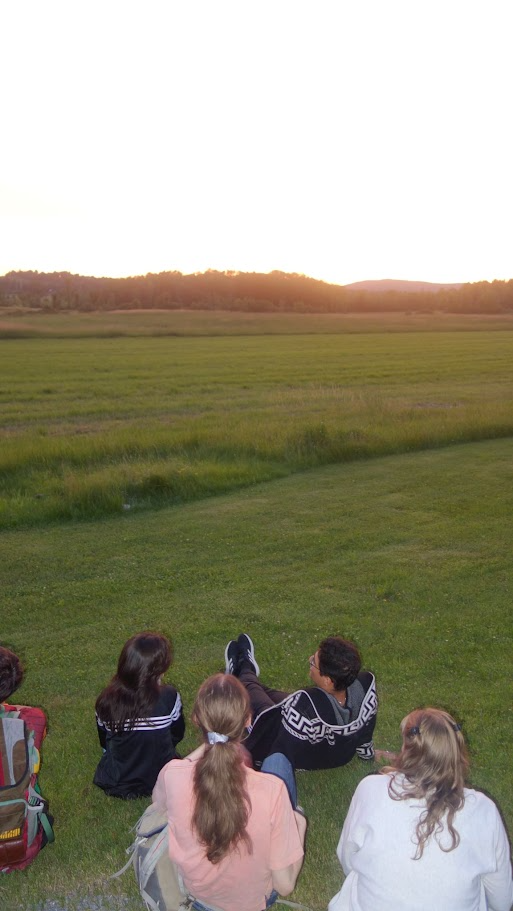 Students watch the sunset in Vermont. 