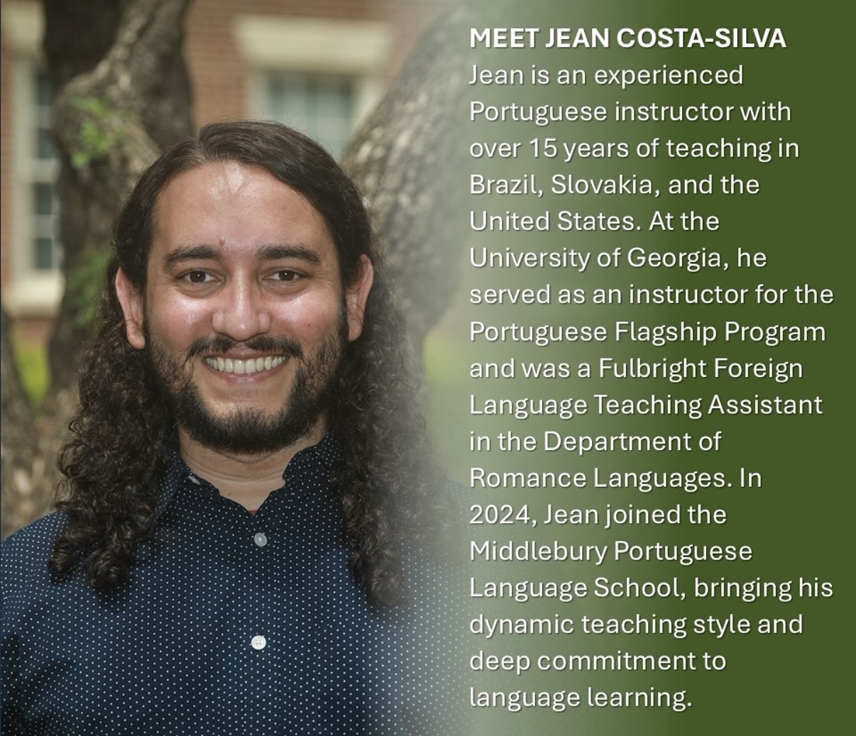 A man in a blue shirt smiles at the camera. 