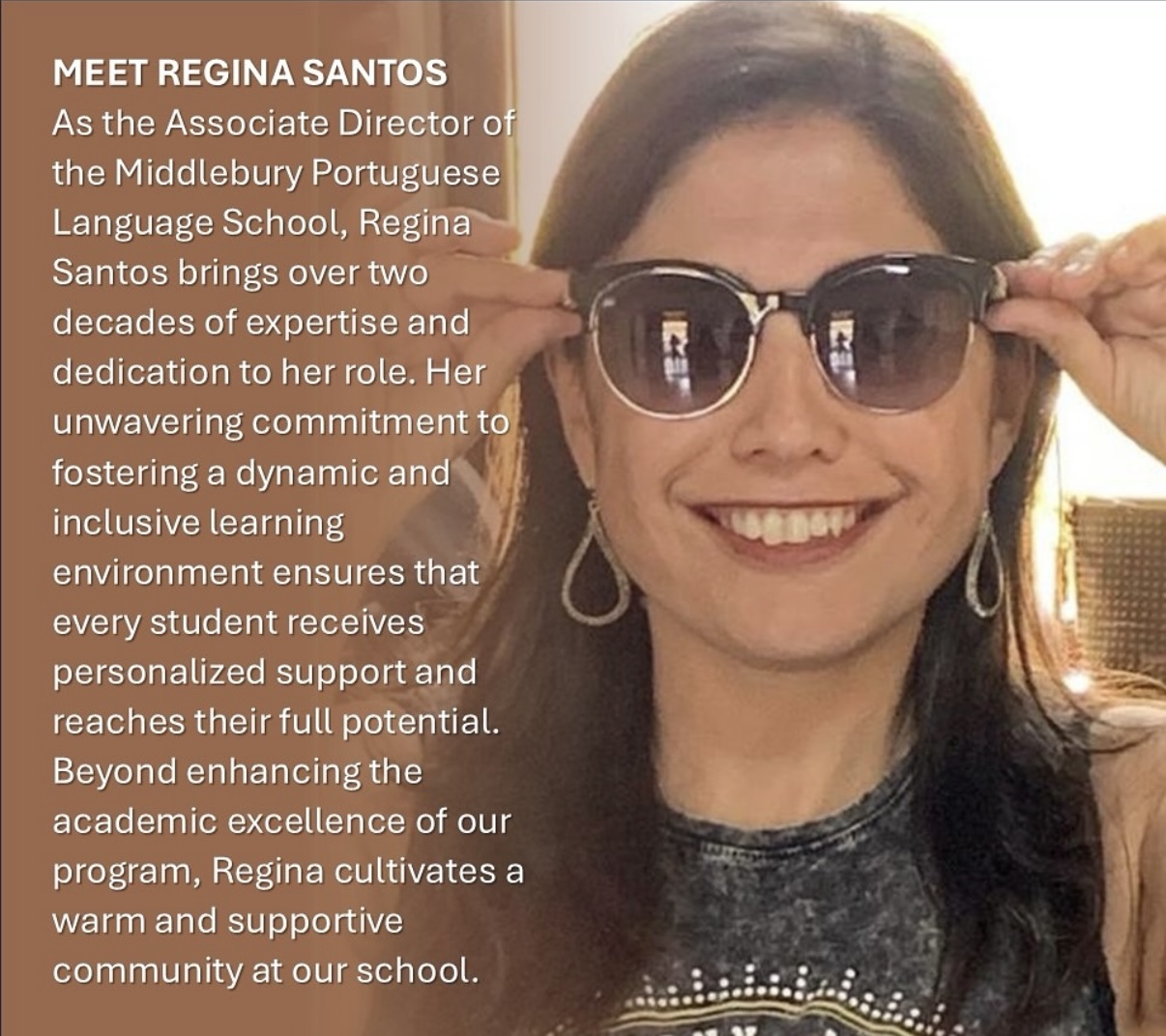 A woman in sunglasses smiles at the camera. 