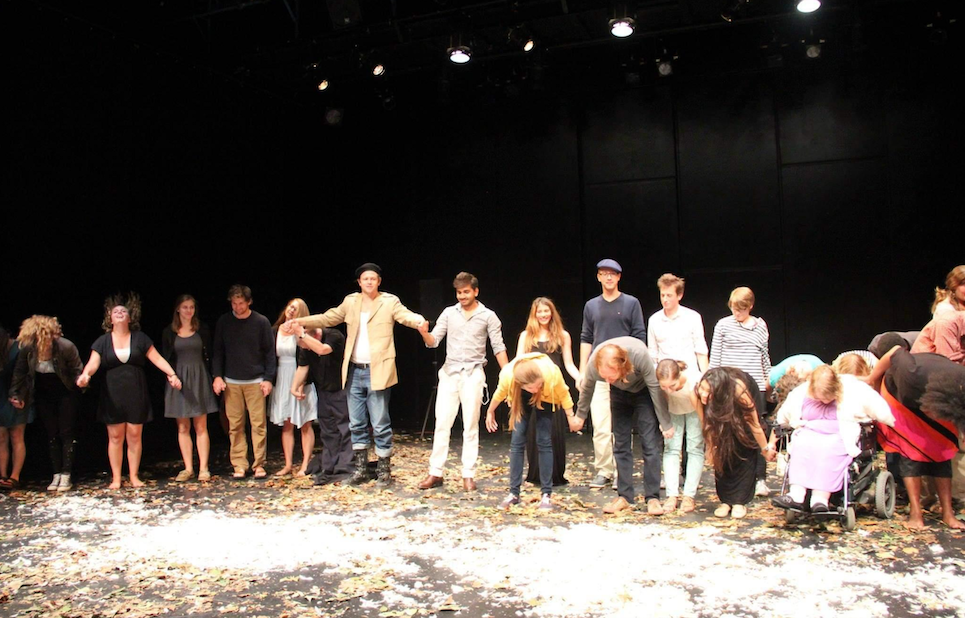 The cast of the School of French play stands for their bow. 