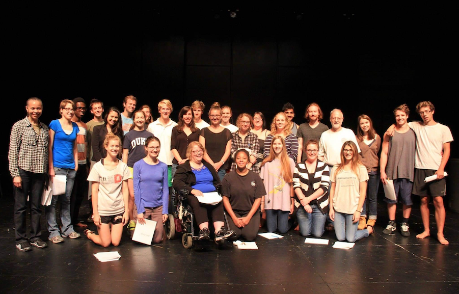 The cast of the School of French play stands smiling. 