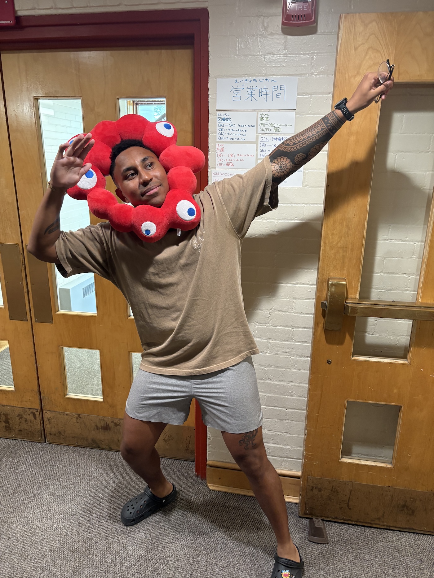 A man wearing a red ring around his head strikes a pose. 