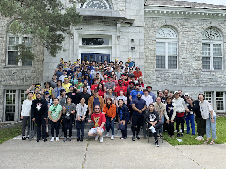 Students at the School of Japanese smile in a group for the camera. 