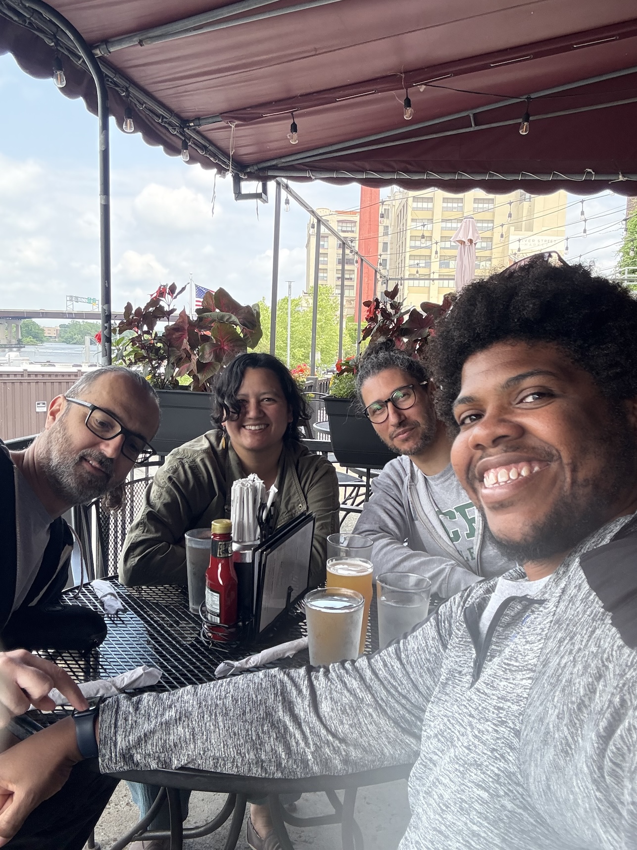 Coworkers eat together at a restaurant. 